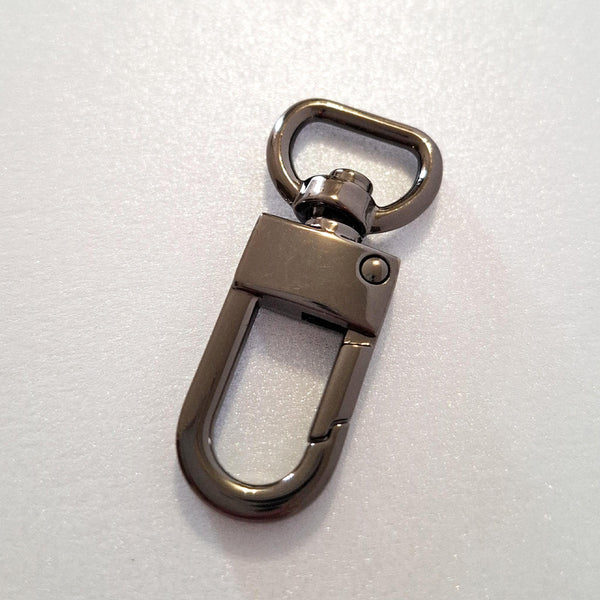 Gun metal dog clip on white background