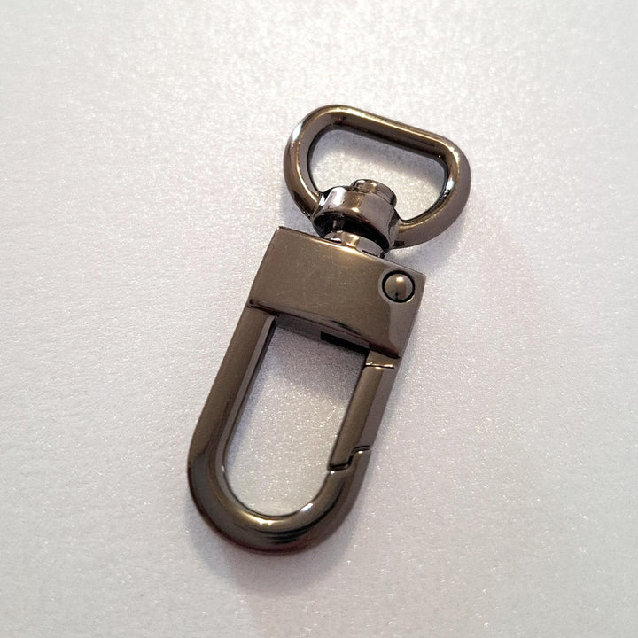 Gun metal dog clip on white background