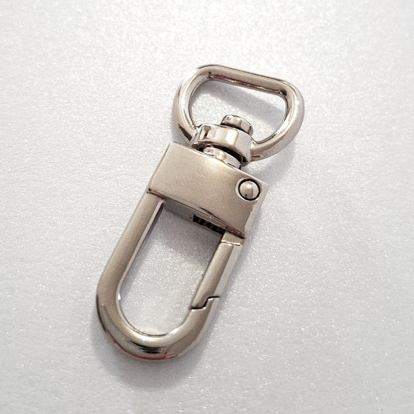 Nickel dog clip on white background