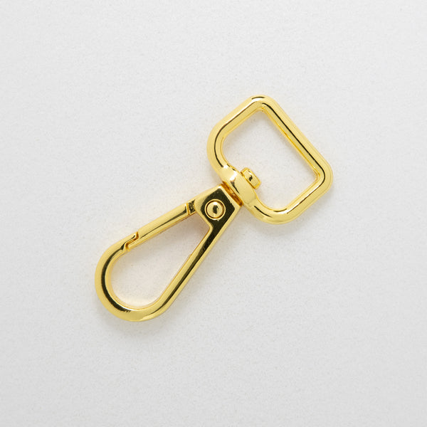 16.5mm gilt dog clip on white background